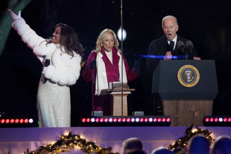 WASHINGTON, DC - NOVEMBER 30: U.S. President Joe Biden (R) and first lady Jill Biden and Mickey Guyton count down to the Lighting Ceremony of the National Christmas Tree in President's Park in the Ellipse of the White House on November 30, 2023 in Washington, DC. High winds toppled the tree on Tuesday but workers were able to right the 40-foot Norway spruce, which was planted just two weeks ago to replace another tree, planted in 2021, that had developed a fungal disease. (Photo by Nathan Howard/Getty Images)